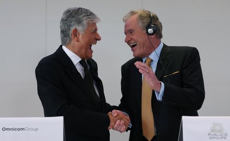 Maurice Levy (L) , French advertising group Publicis Chief executive, and John Wren, head of Omnicom Group react during a joint news confere Maurice Levy (L) , French advertising group Publicis Chief executive, and John Wren, head of Omnicom Group react during a joint news confere