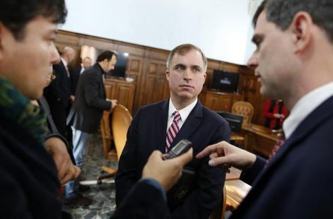 U.S. prosecutors Marshall Miller (C) and William Nardini (R) talk with a reporter at the end of a news conference in Rome February 11, 2014.
CREDIT: REUTERS/TONY GENTILE U.S. prosecutors Marshall Miller (C) and William Nardini (R) talk with a reporter at the end of a news conference in Rome February 11, 2014.
CREDIT: REUTERS/TONY GENTILE