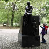 Children play next to the memorial statue of Formula One Brazilian driver Ayrton Senna in the park inside the race track at Imola April 22, Children play next to the memorial statue of Formula One Brazilian driver Ayrton Senna in the park inside the race track at Imola April 22,