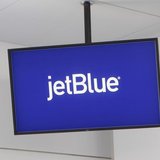 JetBlue Airways logo is displayed on a monitor in Terminal 5 at John F. Kennedy International Airport during a terminal test in New York Aug JetBlue Airways logo is displayed on a monitor in Terminal 5 at John F. Kennedy International Airport during a terminal test in New York Aug