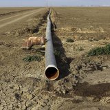 An irrigation pipe is seen on a farm near Cantua Creek, California February 14, 2014. REUTERS/Robert Galbraith An irrigation pipe is seen on a farm near Cantua Creek, California February 14, 2014. REUTERS/Robert Galbraith