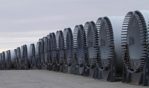 The base of several wind turbine blades are seen outside TPI Composites in Newton, Iowa December 22, 2011. REUTERS/Joshua Lott The base of several wind turbine blades are seen outside TPI Composites in Newton, Iowa December 22, 2011. REUTERS/Joshua Lott