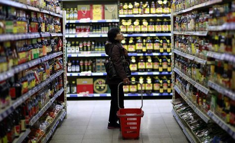 A customer looks at items displayed on shelves at a supermarket in Shenyang, Liaoning province April 11, 2014. REUTERS/Stringer A customer looks at items displayed on shelves at a supermarket in Shenyang, Liaoning province April 11, 2014. REUTERS/Stringer