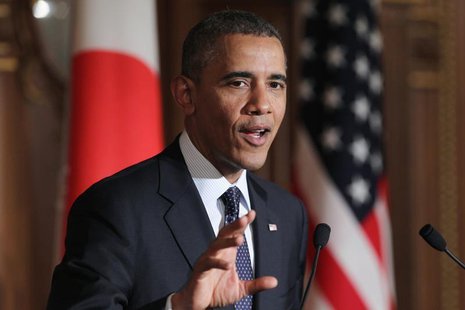 U.S. President Barack Obama gestures during a news conference with Japanese Prime Minister Shinzo Abe (not seen) at the Akasaka guesthouse i U.S. President Barack Obama gestures during a news conference with Japanese Prime Minister Shinzo Abe (not seen) at the Akasaka guesthouse i