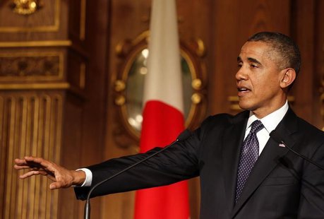 U.S. President Barack Obama makes a point next to Japan's Prime Minister Shinzo Abe at a joint news conference in the Akasaka Palace in Toky U.S. President Barack Obama makes a point next to Japan's Prime Minister Shinzo Abe at a joint news conference in the Akasaka Palace in Toky
