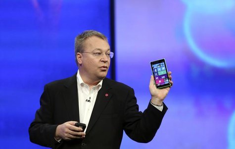 Stephen Elop, vice president of Nokia, gestures while introducing the Nokia Lumia 930 mobile phone during Microsoft's "build" conference in Stephen Elop, vice president of Nokia, gestures while introducing the Nokia Lumia 930 mobile phone during Microsoft's "build" conference in