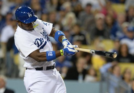 Apr 23, 2014; Los Angeles, CA, USA; Los Angeles Dodgers right fielder Yasiel Puig (66) singles in a run in the fifth inning of the game agai Apr 23, 2014; Los Angeles, CA, USA; Los Angeles Dodgers right fielder Yasiel Puig (66) singles in a run in the fifth inning of the game agai