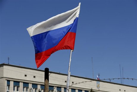 The Russian national flag is seen on a barricade near the seized office of the SBU state security service in Luhansk, eastern Ukraine April The Russian national flag is seen on a barricade near the seized office of the SBU state security service in Luhansk, eastern Ukraine April