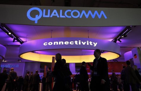 Visitors walk past the Qualcomm stand at the Mobile World Congress in Barcelona, February 24, 2014. REUTERS/Albert Gea Visitors walk past the Qualcomm stand at the Mobile World Congress in Barcelona, February 24, 2014. REUTERS/Albert Gea