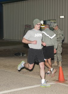 Spc. Zackary Warnke with the 32nd Infantry Brigade Combat Team, crosses the finish line in the two-mile run event during the Army Physical Fitness Test during the 2014 State Best Warrior Competition at Fort McCoy, Wis., April 11. (Courtesy: Mobile Public Affairs Detachment photo by Staff Sgt. Megan Leuck) Spc. Zackary Warnke with the 32nd Infantry Brigade Combat Team, crosses the finish line in the two-mile run event during the Army Physical Fitness Test during the 2014 State Best Warrior Competition at Fort McCoy, Wis., April 11. (Courtesy: Mobile Public Affairs Detachment photo by Staff Sgt. Megan Leuck)