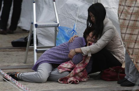 A relative of a missing passenger onboard the capsized Sewol ferry cries at a port in Jindo April 26, 2014. REUTERS/Kim Kyung-Hoon A relative of a missing passenger onboard the capsized Sewol ferry cries at a port in Jindo April 26, 2014. REUTERS/Kim Kyung-Hoon