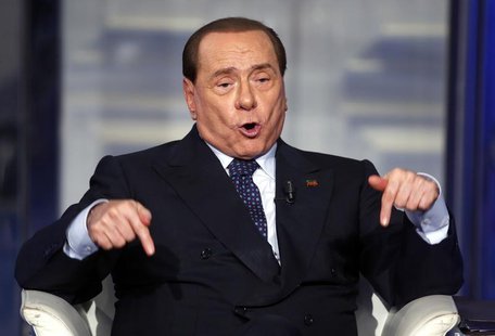 Italy's former Prime Minister Silvio Berlusconi gestures as he appears as a guest on the RAI television show Porta a Porta (Door to Door) in Italy's former Prime Minister Silvio Berlusconi gestures as he appears as a guest on the RAI television show Porta a Porta (Door to Door) in