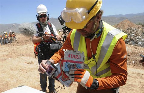 Archaeologist Andrew Reinhard (R) shows off the first E.T. the Extra-Terrestrial cartridges recovered from the old Alamogordo landfill, in A Archaeologist Andrew Reinhard (R) shows off the first E.T. the Extra-Terrestrial cartridges recovered from the old Alamogordo landfill, in A