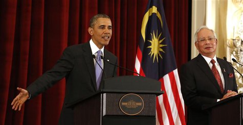 U.S. President Barack Obama talks next to Malaysian Prime Minister Najib Razak as they both participate in a news press conference at the Pe U.S. President Barack Obama talks next to Malaysian Prime Minister Najib Razak as they both participate in a news press conference at the Pe