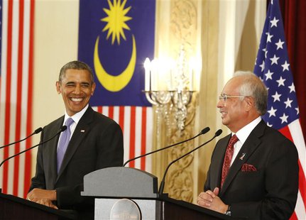 U.S. President Barack Obama and Malaysian Prime Minister Najib Razak both smile as they participate in a joint news conference at the Perdan U.S. President Barack Obama and Malaysian Prime Minister Najib Razak both smile as they participate in a joint news conference at the Perdan