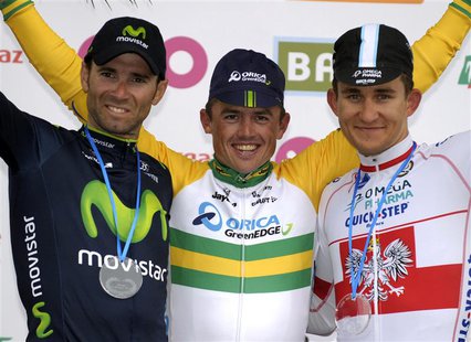 Orica-GreenEdge rider Simon Gerrans of Australia (C) celebrates on the podium after winning the Liege-Bastogne-Liege Classic cycling race, f Orica-GreenEdge rider Simon Gerrans of Australia (C) celebrates on the podium after winning the Liege-Bastogne-Liege Classic cycling race, f