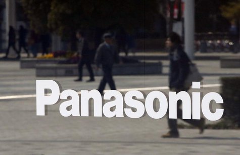 People walking past are reflected in a sign at Panasonic Center Tokyo in Tokyo March 12, 2014. REUTERS/Toru Hanai People walking past are reflected in a sign at Panasonic Center Tokyo in Tokyo March 12, 2014. REUTERS/Toru Hanai