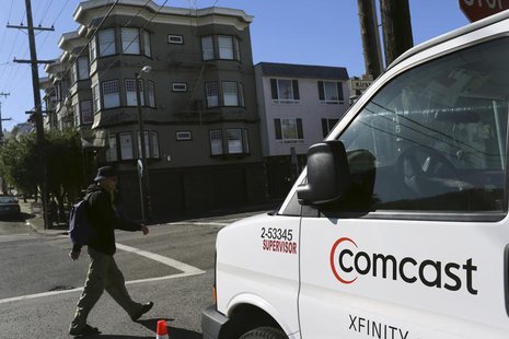 A Comcast sign is shown on the side of a vehicle in San Francisco, California February 13, 2014. REUTERS/Robert Galbraith A Comcast sign is shown on the side of a vehicle in San Francisco, California February 13, 2014. REUTERS/Robert Galbraith