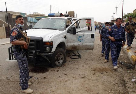 Iraqi security forces inspect the site of a suicide bombing outside a polling station in Kirkuk April 28, 2014. REUTERS/Ako Rasheed Iraqi security forces inspect the site of a suicide bombing outside a polling station in Kirkuk April 28, 2014. REUTERS/Ako Rasheed