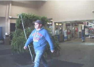 One of two break-in suspects walking out of store (courtesy Michigan State Police) One of two break-in suspects walking out of store (courtesy Michigan State Police)