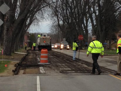 Workers begin removing asphalt on LS Workers begin removing asphalt on LS