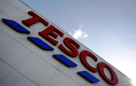A store sign is seen outside a Tesco supermarket in London April 15, 2014. REUTERS/Luke MacGregor A store sign is seen outside a Tesco supermarket in London April 15, 2014. REUTERS/Luke MacGregor