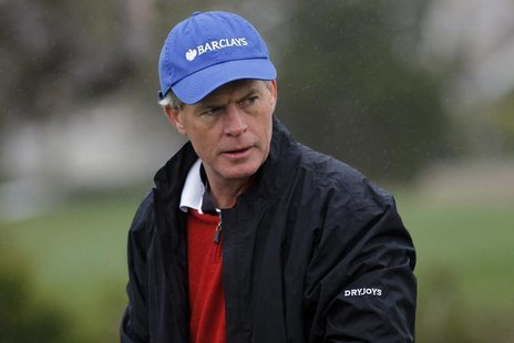 CEO of Barclays Americas Hugh "Skip" McGee III dons a rain jacket during the second round of the Pebble Beach National Pro-Am golf tournamen CEO of Barclays Americas Hugh "Skip" McGee III dons a rain jacket during the second round of the Pebble Beach National Pro-Am golf tournamen