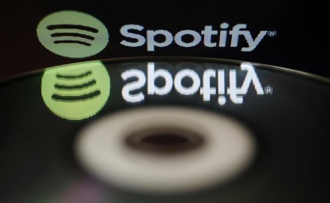 The logo of online music streaming service Spotify is reflected in an audio music CD in this illustration picture taken in Strasbourg, Febru The logo of online music streaming service Spotify is reflected in an audio music CD in this illustration picture taken in Strasbourg, Febru