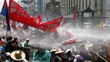 Protesters are sprayed with water cannons outside the U.S. Embassy in Manila in protest to the visit by President Obama. REUTERS/Erik De Castro Protesters are sprayed with water cannons outside the U.S. Embassy in Manila in protest to the visit by President Obama. REUTERS/Erik De Castro