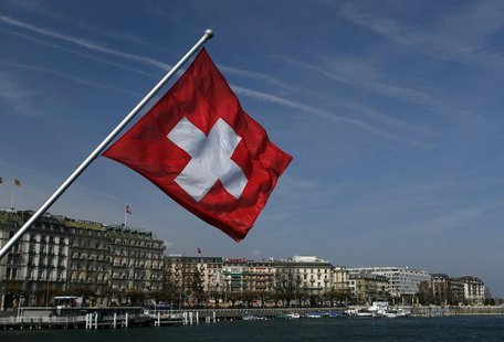 A Swiss flag is pictured on the Mont-Blanc bridge over Lake Leman in Geneva March 21, 2014. REUTERS/Denis Balibouse A Swiss flag is pictured on the Mont-Blanc bridge over Lake Leman in Geneva March 21, 2014. REUTERS/Denis Balibouse