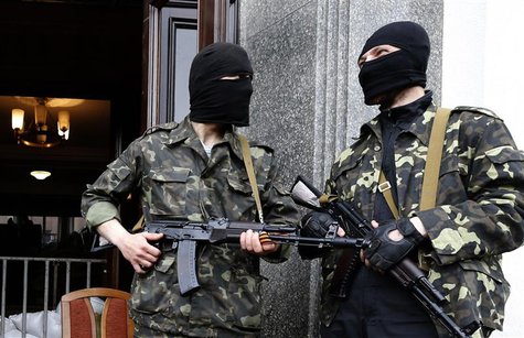 Pro-Russian armed men stand at the entrance to the regional government headquarters in Luhansk, eastern Ukraine, April 30, 2014. REUTERS/Vas Pro-Russian armed men stand at the entrance to the regional government headquarters in Luhansk, eastern Ukraine, April 30, 2014. REUTERS/Vas