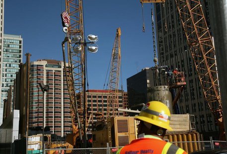 A worker stands in front of a construction site in San Francisco, California January 5, 2012. REUTERS/Robert Galbraith A worker stands in front of a construction site in San Francisco, California January 5, 2012. REUTERS/Robert Galbraith