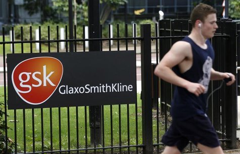 A jogger runs past a signage for pharmaceutical giant GlaxoSmithKline (GSK) in London April 22, 2014. REUTERS/Luke MacGregor A jogger runs past a signage for pharmaceutical giant GlaxoSmithKline (GSK) in London April 22, 2014. REUTERS/Luke MacGregor