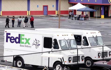 Fed-Ex employees and friends wait at a staging area at a skating rink after a shooting at a FedEX Corp facility at an airport in Kennesaw, G Fed-Ex employees and friends wait at a staging area at a skating rink after a shooting at a FedEX Corp facility at an airport in Kennesaw, G