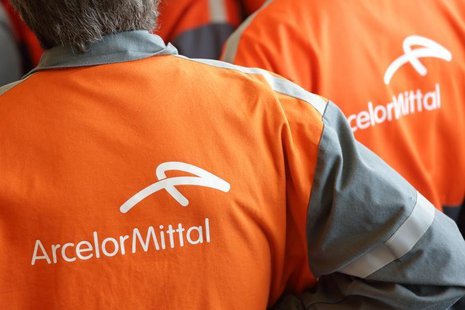 Workers listen to French President's speech during a visit at ArcelorMittal steel factory in Florange, Eastern France, September 26, 2013. R Workers listen to French President's speech during a visit at ArcelorMittal steel factory in Florange, Eastern France, September 26, 2013. R