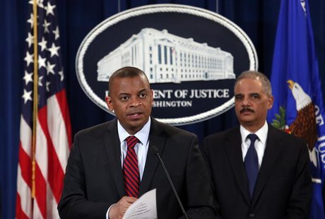 U.S. Transportation Secretary Anthony Foxx (L) and Attorney General Eric Holder hold a news conference at the Justice Department in Washingt U.S. Transportation Secretary Anthony Foxx (L) and Attorney General Eric Holder hold a news conference at the Justice Department in Washingt