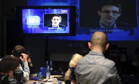 Journalists listen to a speech and a question posed by former U.S. spy agency NSA contractor Edward Snowden, at a media centre during Russia Journalists listen to a speech and a question posed by former U.S. spy agency NSA contractor Edward Snowden, at a media centre during Russia