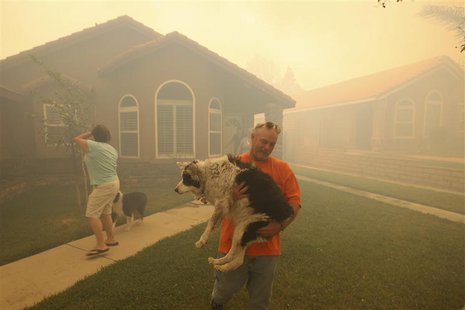 People evacuate from their homes as a wildfire driven by fierce Santa Ana winds closes in on them in Rancho Cucamonga, California, April 30, People evacuate from their homes as a wildfire driven by fierce Santa Ana winds closes in on them in Rancho Cucamonga, California, April 30,