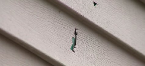 Bullet holes in a home in the Oconto County Town of Morgan. (Photo from: FOX 11/YouTube). Bullet holes in a home in the Oconto County Town of Morgan. (Photo from: FOX 11/YouTube).