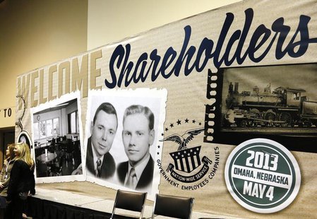 A billboard welcoming Berkshire Hathaway shareholders, displays a vintage picture of Chairman Warren Buffett (L) and Vice Chairman Charlie M A billboard welcoming Berkshire Hathaway shareholders, displays a vintage picture of Chairman Warren Buffett (L) and Vice Chairman Charlie M