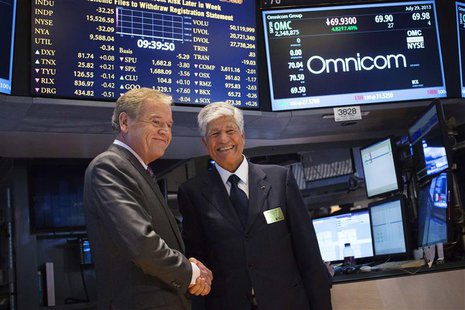 Omnicom Chief Executive John Wren (L) and Publicis Group Chairman and CEO Maurice Levy shake hands after announcing an agreement on their me Omnicom Chief Executive John Wren (L) and Publicis Group Chairman and CEO Maurice Levy shake hands after announcing an agreement on their me