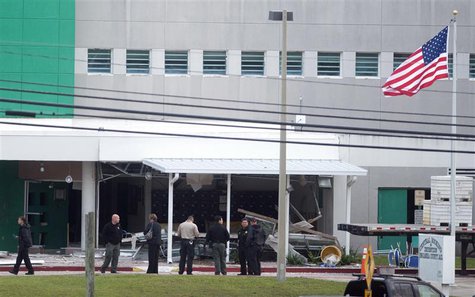 Police officers maintain a cordon after an apparent gas explosion killed two and injured over 100 inmates and guards at Escambia County jail Police officers maintain a cordon after an apparent gas explosion killed two and injured over 100 inmates and guards at Escambia County jail