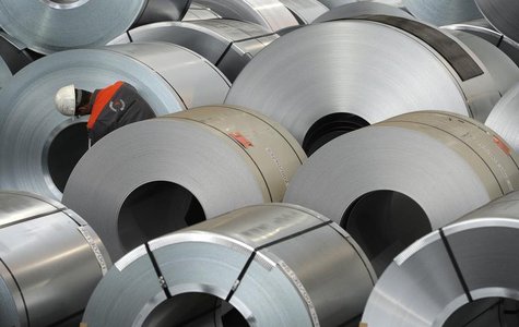An employee inspects some steel at the plant of German steel company Salzgitter AG in Salzgitter, Lower Saxony late November 10, 2011. REUTE An employee inspects some steel at the plant of German steel company Salzgitter AG in Salzgitter, Lower Saxony late November 10, 2011. REUTE