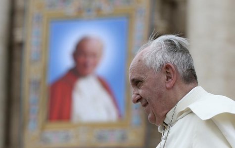 Pope Francis passes next to a tapestry of the late Pope John Paul II, as he leaves at the end of his weekly general audience at St. Peter's Pope Francis passes next to a tapestry of the late Pope John Paul II, as he leaves at the end of his weekly general audience at St. Peter's