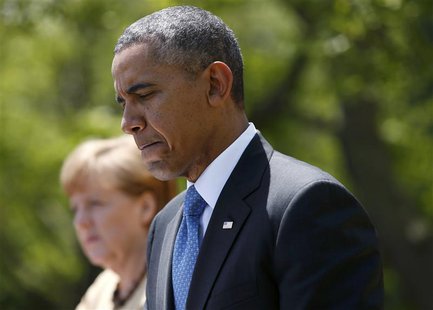 U.S. President Barack Obama pauses during a joint news conference with German Chancellor Angela Merkel in the Rose Garden of the White House U.S. President Barack Obama pauses during a joint news conference with German Chancellor Angela Merkel in the Rose Garden of the White House