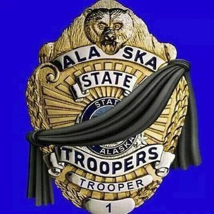 An illustration showing a black band across an officer's shield appears on the official Facebook page of the Alaska State Troopers in Anchor An illustration showing a black band across an officer's shield appears on the official Facebook page of the Alaska State Troopers in Anchor