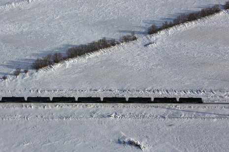 An aerial view shows a train making its way along the Burlington Northern Santa Fe (BNSF) rail line outside of Williston, North Dakota March An aerial view shows a train making its way along the Burlington Northern Santa Fe (BNSF) rail line outside of Williston, North Dakota March