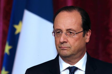 French President Francois Hollande pauses as he attends a news conference at the Elysee Palace in Paris, April 29, 2014. REUTERS/Philippe Wo French President Francois Hollande pauses as he attends a news conference at the Elysee Palace in Paris, April 29, 2014. REUTERS/Philippe Wo