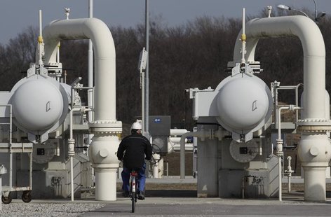 A worker rides a bicycle past gas pipes at Gas Connect Austria's gas distribution node in Baumgarten some 40 km (25 miles) east of Vienna Ma A worker rides a bicycle past gas pipes at Gas Connect Austria's gas distribution node in Baumgarten some 40 km (25 miles) east of Vienna Ma