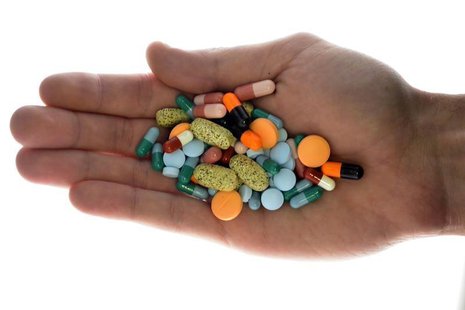 A person holds pharmaceutical tablets and capsules in this picture illustration taken in Ljubljana September 18, 2013. Picture taken Septemb A person holds pharmaceutical tablets and capsules in this picture illustration taken in Ljubljana September 18, 2013. Picture taken Septemb